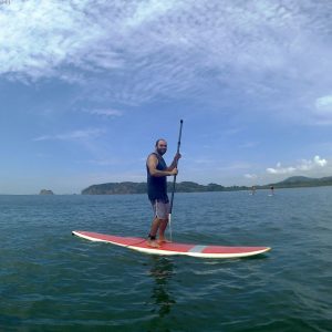 Person at the stand up paddle board tour